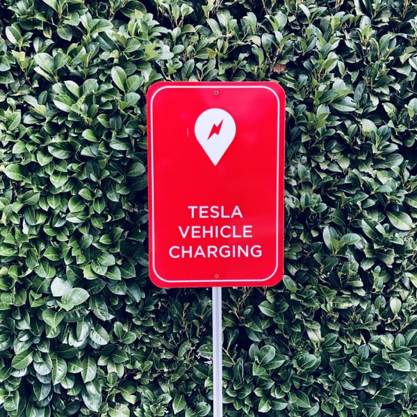 sign, “Tesla Vehicle Charging”