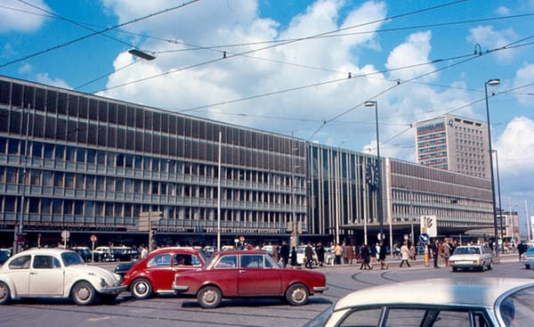 Munich — Hauptbahnhof (main train station). Street view of station with lots of 1970s cars in foreground.